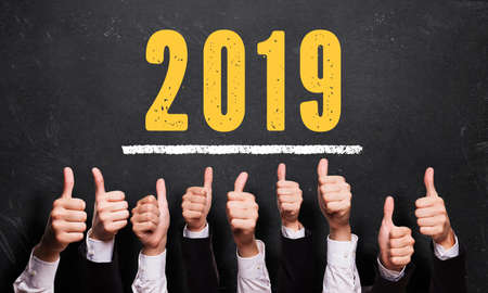 many thumbs up with message 2019 on a blackboardの写真素材