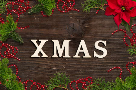 classic christmas decoration and the word XMAS  on wooden backgroundの写真素材
