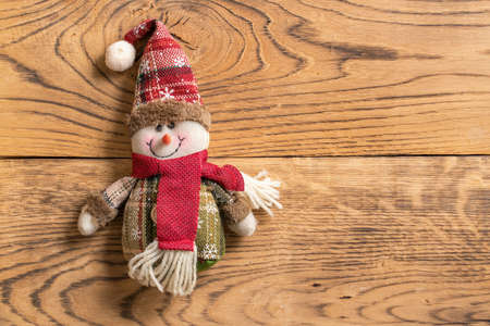cute Snowman rag doll on wooden backgroundの写真素材