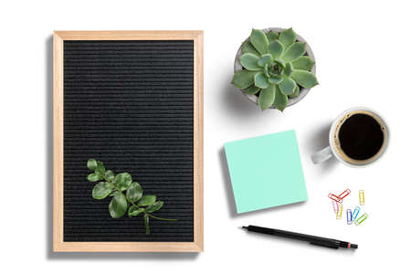 empty letter board with wooden frame with coffee, pen and sticky notes on white backgroundの写真素材