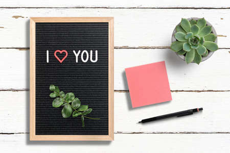 message I love you on a letter board on wooden background