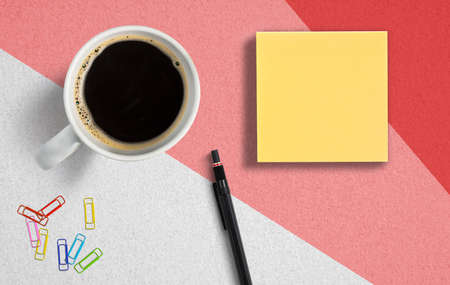 office utensils and coffee on colorful paper background