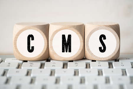 acronym CMS on cubes on a computer keyboard