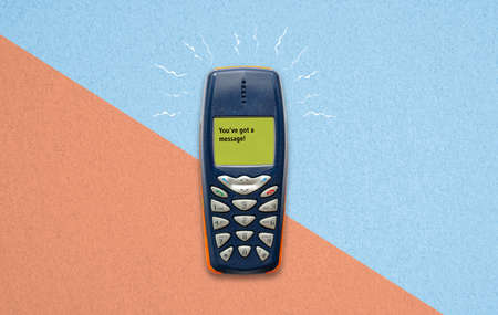 classic feature phone on paper background