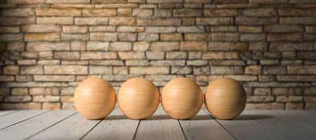 wooden empty balls for own text in front of a brick wall on wooden floor - 3D rendered illustrationの写真素材