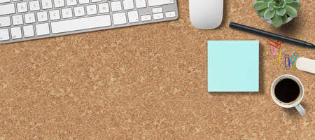 modern computer workspace on cork backgroundの写真素材