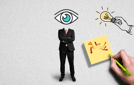 headless businessman on paper background has an idea