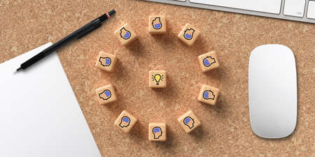 cubes showing a brainstorming session at a modern computer workspace on cork backgroundの写真素材