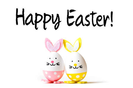 Easter Eggs with bunny ears and message Happy Easter on white background