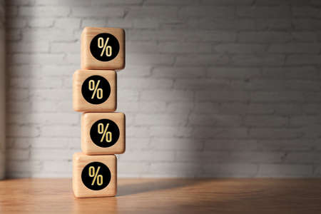 cubes with black percent signs on wooden floor in front of a brick wall - 3D rendered illustration