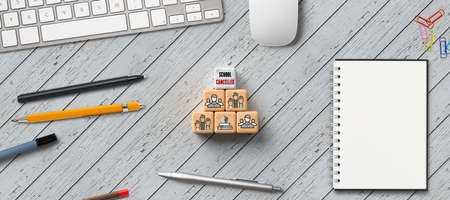 cubes with message SCHOOL CANCELLED and computer equipment on wooden background