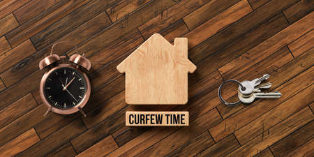 wooden blocks in shape of a house with text CURFEW TIME on wooden background