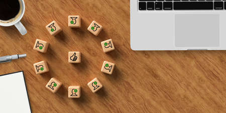 cube with icons symbolizing a meeting and office items on wooden background