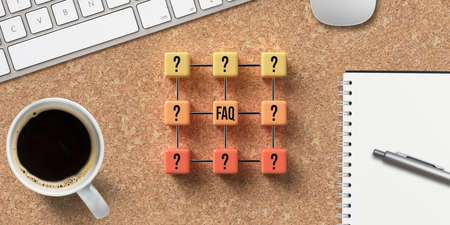 grid of cubes with questionmarks and text FAQ with office equipment on cork backgroundの写真素材