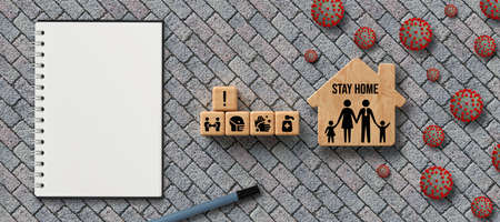 cubes with text STAY HOME and health symbols on stone pavement