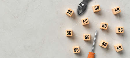 cube grid with 5G symbols symbolizing connected network nodes and tools that are maintaining the...