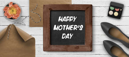 blackboard with message HAPPY MOTHER'S DAY on white painted wooden backgroundの写真素材