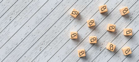 many cubes with speech bubble icons on wooden background - 3D rendered illustrationの写真素材