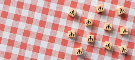cubes with day care icons on kitchen tablecloth background - 3D rendered illustration