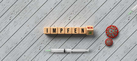 cubes with German message VACCINATE and options YES or NO with syringe and virus model on wooden...