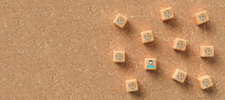 cube-grid with icons symbolizing a conference call on cork background - 3D rendered illustrationの写真素材