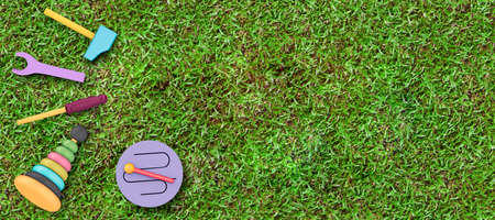 baby toys on green grass backgroundの写真素材