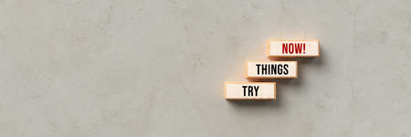 cubes with message TRY THINGS NOW! on concrete background - 3d illustration