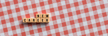 cubes with message NEW CAREER on kitchen table background - 3d illustrationの写真素材