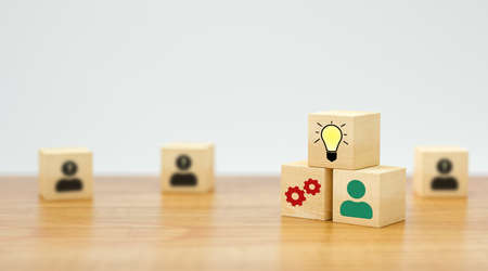 cubes showing a brainstorming session on wooden table and white background - 3d illustration