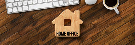 wooden house with message HOME OFFICE on wooden background