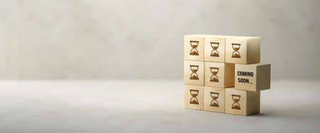 cube with message COMING SOON on concrete background - 3d illustrationの写真素材