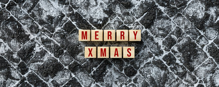 cubes with message XMAS and christmas decoration on lava stone background - 3d illustration - 3d illustrationの写真素材