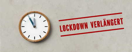 clock and  German message for LOCKDOWN EXTENDED on paper background - 3d illustration