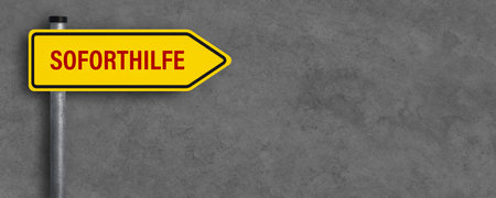 street sign with German message for IMMEDIATE HELP in front of concrete background - 3d illustrationの写真素材