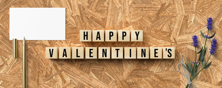 cubes with message HAPPY VALENTINE'S and romantic decoration on wooden backgroundの写真素材