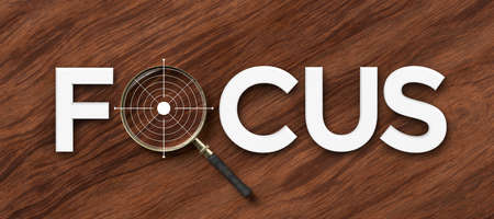 Focus concept with white text and magnifying glass in place of letter O over a target or bulls eye in a conceptual image on a panorama wood background - 3d illustrationの写真素材