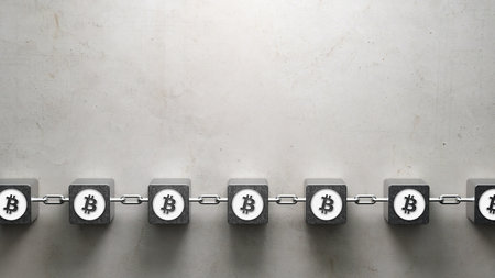 cubes interlocked with chains and bitcoin symbols symbolizing a blockchain on concrete background -...