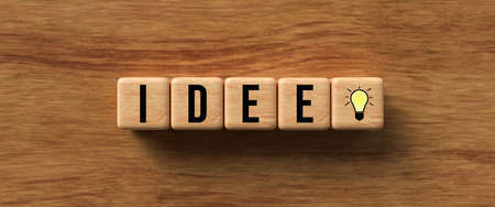 wooden cubes with German message for IDEA on wooden background - 3d illustration