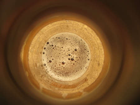 Bottom of a glass bottle on a white backgroundの写真素材