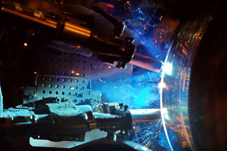 Welding of the pipeline. Process of creation of welding connection by the special mobile machine.