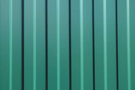 Diagonal pattern of metal profile. Fences from the galvanized iron painted by a polymeric covering.の写真素材
