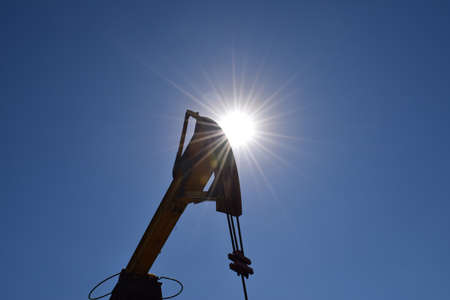 The pumping unit as the oil pump installed on a well. Equipment of oil fields.の写真素材