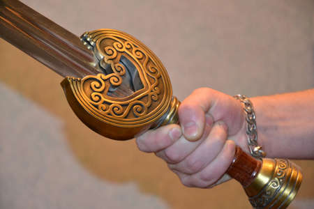 Sword at a hand. Fitting of the knightly weapon.の写真素材
