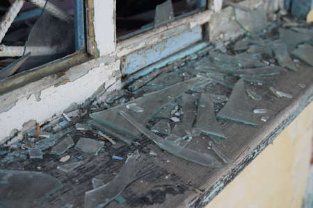 Windows with the broken glasses. The old thrown gas station.