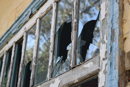 Windows with the broken glasses. The old thrown gas station.