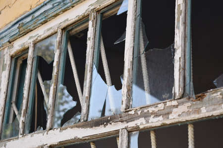 Windows with the broken glasses. The old thrown gas station.