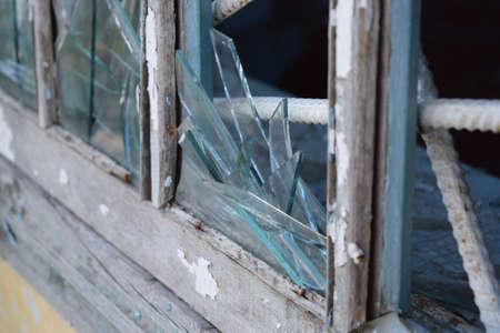 Windows with the broken glasses. The old thrown gas station.