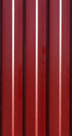 Diagonal pattern of metal profile. Fences from the galvanized iron painted by a polymeric covering.の写真素材