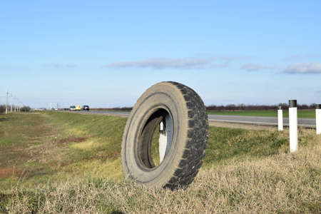 RUSSIA, TRUDOBELIKI - DECEMBER 23, ? ?2015. Rubber tire of a wheel at the intersection. A wheel at the road.のeditorial素材
