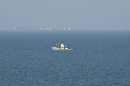 Little old ship in the sea. Taman Bay.